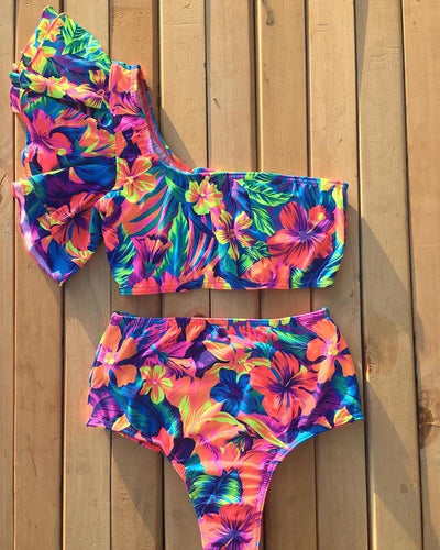 Vibrant one-shoulder ruffle print swimsuit with a lace-up top and high-waisted ruched bottoms, featuring a tropical floral pattern. - Image 6