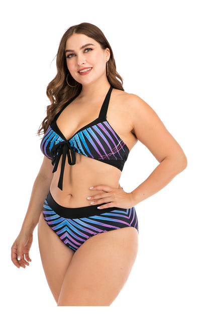 Plus size two-piece swimsuit with a black base, colorful geometric pattern, criss-cross top, and high-waisted bottom. - Image 9