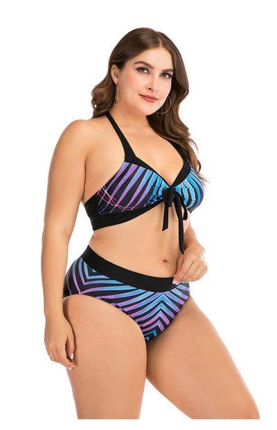 Plus size two-piece swimsuit with a black base, colorful geometric pattern, criss-cross top, and high-waisted bottom. - Image 10