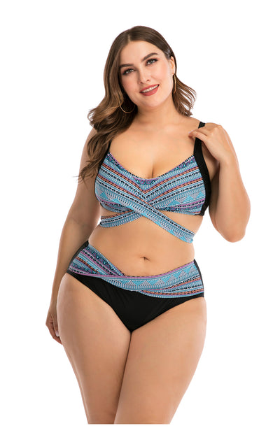 Plus size two-piece swimsuit with a black base, colorful geometric pattern, criss-cross top, and high-waisted bottom. - Image 25