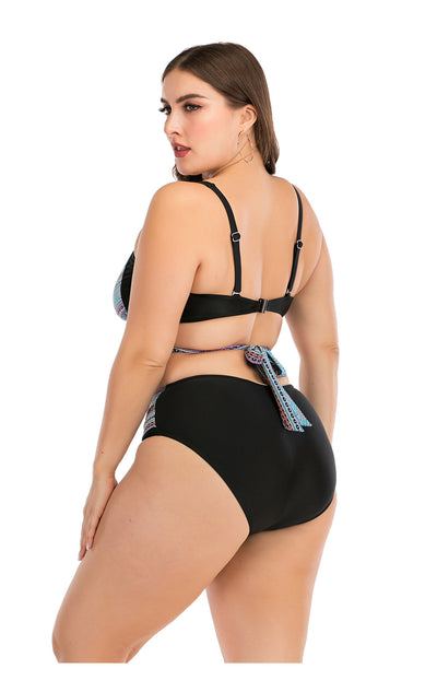 Plus size two-piece swimsuit with a black base, colorful geometric pattern, criss-cross top, and high-waisted bottom. - Image 27