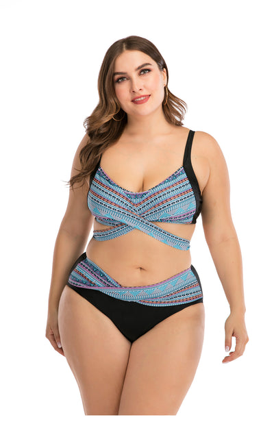 Plus size two-piece swimsuit with a black base, colorful geometric pattern, criss-cross top, and high-waisted bottom. - Image 28