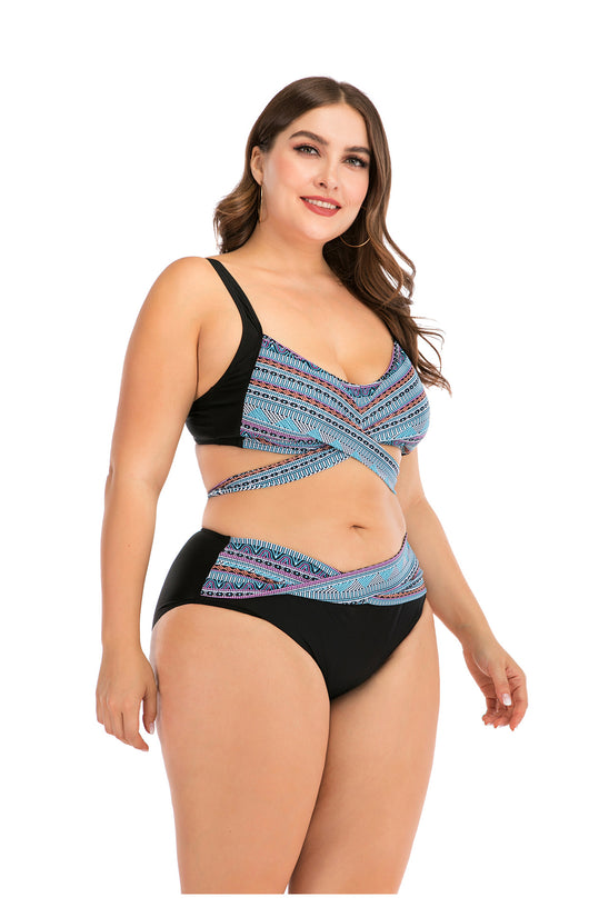 Plus size two-piece swimsuit with a black base, colorful geometric pattern, criss-cross top, and high-waisted bottom. - Image 29