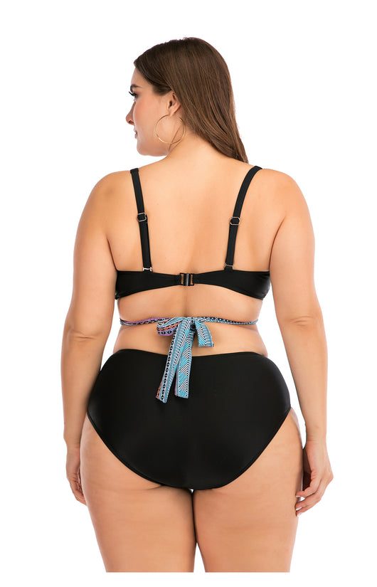 Plus size two-piece swimsuit with a black base, colorful geometric pattern, criss-cross top, and high-waisted bottom. - Image 31