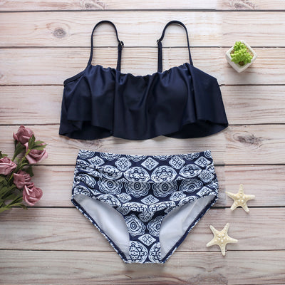 Navy blue ruffled tube top swimsuit with high-waisted bottoms featuring a white geometric pattern. - Image 19