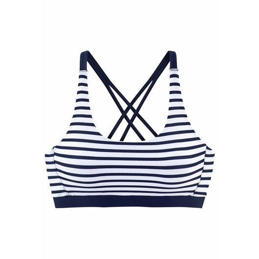 Woman smiling on a beach wearing a navy and white striped two-piece bikini with a racerback top. - Image 9