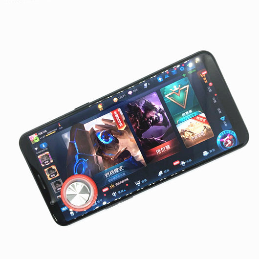 Pink and silver mobile game joystick attached to a black smartphone displaying a game on its screen. - Image 6