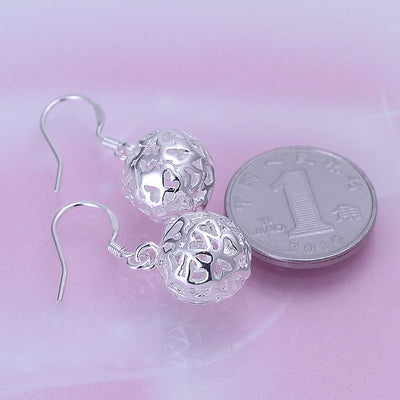 Aretes de Corazón Hueco - Image 7