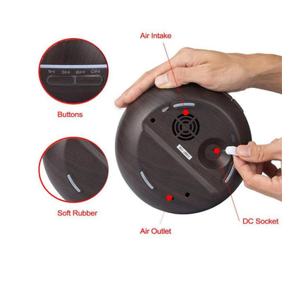 Wood grain ultrasonic aromatherapy diffuser and humidifier with a glowing blue LED light band and control buttons. - Image 21