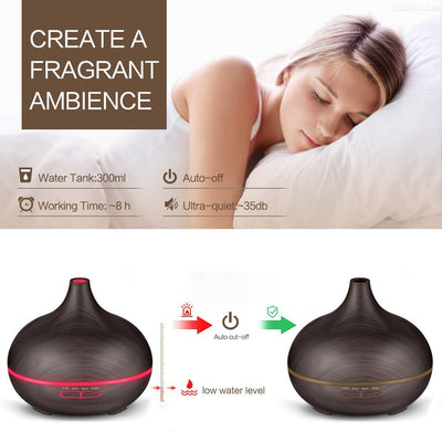 Wood grain ultrasonic aromatherapy diffuser and humidifier with a glowing blue LED light band and control buttons. - Image 17