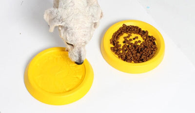 Bright yellow EVA pet ball dog toy with textured grooves and paw print details for interactive play. - Image 29