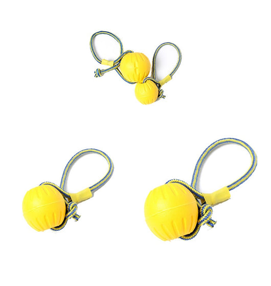 Bright yellow EVA pet ball dog toy with textured grooves and paw print details for interactive play. - Image 22
