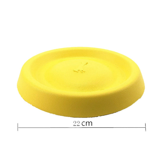 Bright yellow EVA pet ball dog toy with textured grooves and paw print details for interactive play. - Image 24