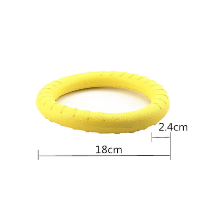 Bright yellow EVA pet ball dog toy with textured grooves and paw print details for interactive play. - Image 25