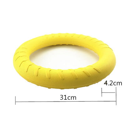 Bright yellow EVA pet ball dog toy with textured grooves and paw print details for interactive play. - Image 26