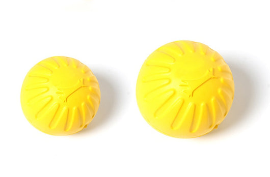Bright yellow EVA pet ball dog toy with textured grooves and paw print details for interactive play. - Image 27