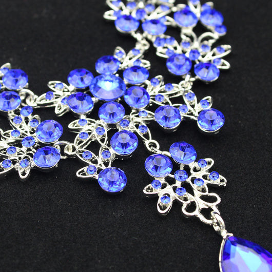 Purple crystal necklace and earring set with butterfly and floral designs, featuring large teardrop pendants. - Image 8