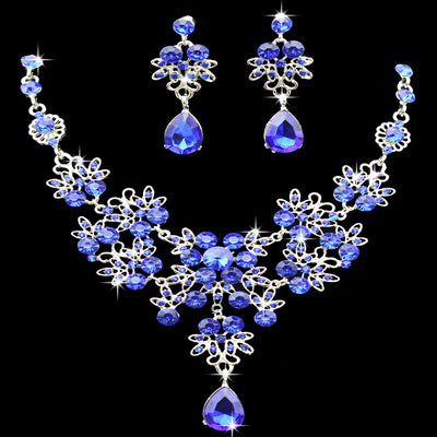 Purple crystal necklace and earring set with butterfly and floral designs, featuring large teardrop pendants. - Image 10
