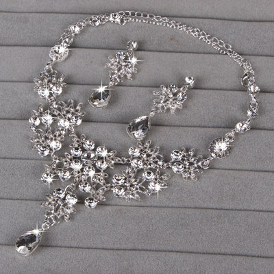 Purple crystal necklace and earring set with butterfly and floral designs, featuring large teardrop pendants. - Image 16
