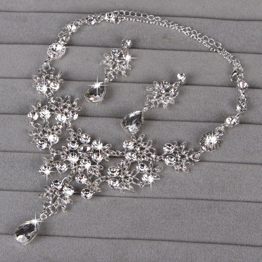 Purple crystal necklace and earring set with butterfly and floral designs, featuring large teardrop pendants. - Image 16