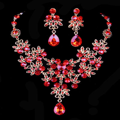 Purple crystal necklace and earring set with butterfly and floral designs, featuring large teardrop pendants. - Image 17