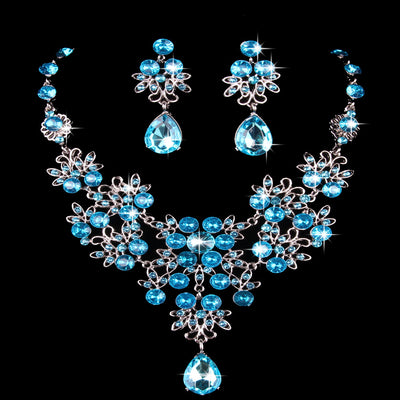 Purple crystal necklace and earring set with butterfly and floral designs, featuring large teardrop pendants. - Image 20