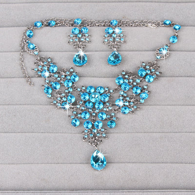 Purple crystal necklace and earring set with butterfly and floral designs, featuring large teardrop pendants. - Image 21