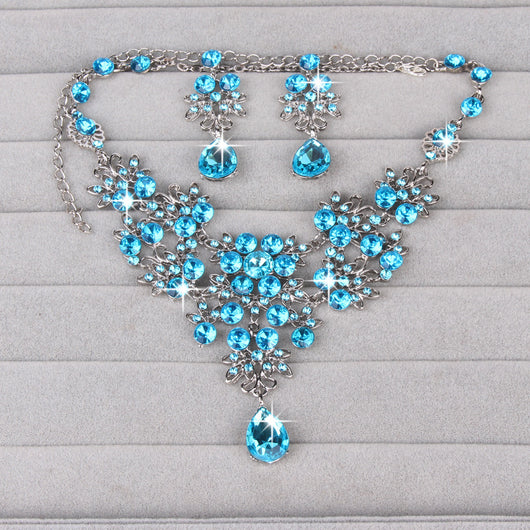 Purple crystal necklace and earring set with butterfly and floral designs, featuring large teardrop pendants. - Image 21