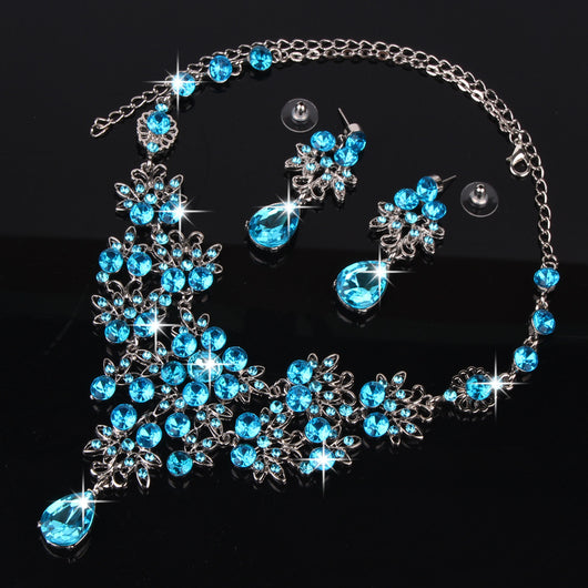 Purple crystal necklace and earring set with butterfly and floral designs, featuring large teardrop pendants. - Image 22