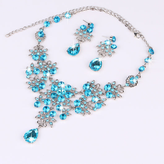 Purple crystal necklace and earring set with butterfly and floral designs, featuring large teardrop pendants. - Image 23