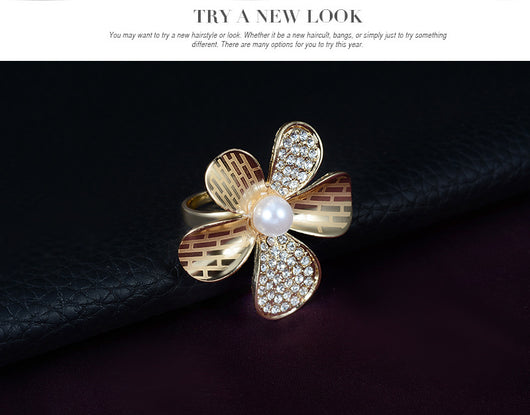 Gold-tone four-piece jewelry set with flower motifs, featuring a necklace, bracelet, ring, and earrings, all with faux pearls and clear rhinestones. - Image 14