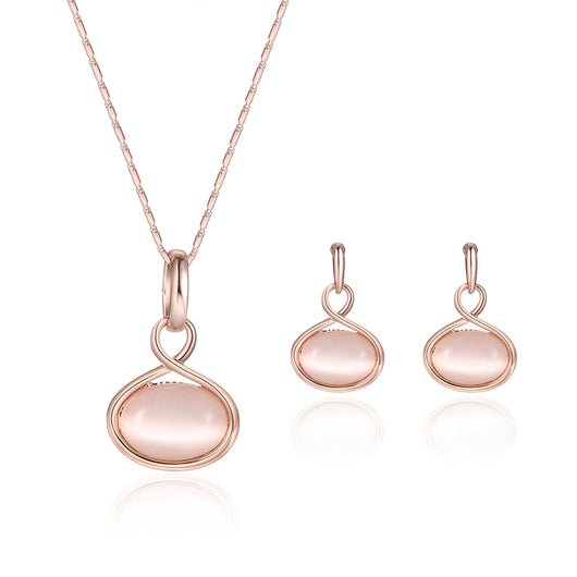 Rose gold necklace and matching drop earrings set with oval light pink cabochon stones. - Image 7