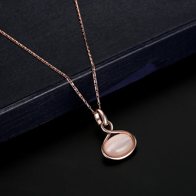 Rose gold necklace and matching drop earrings set with oval light pink cabochon stones. - Image 11
