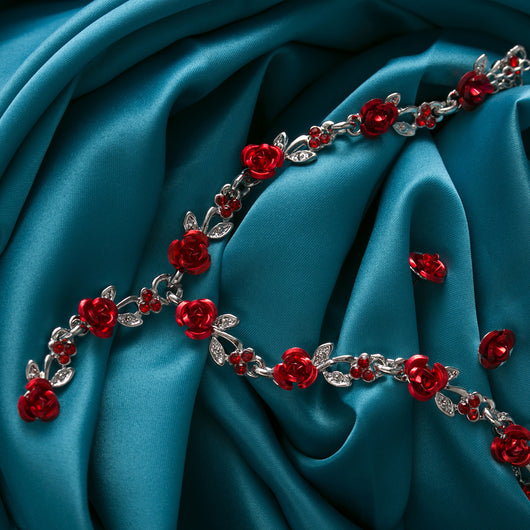 Red rose alloy necklace and stud earrings set with silver-tone chain and clear accents, displayed on a black bust. - Image 8
