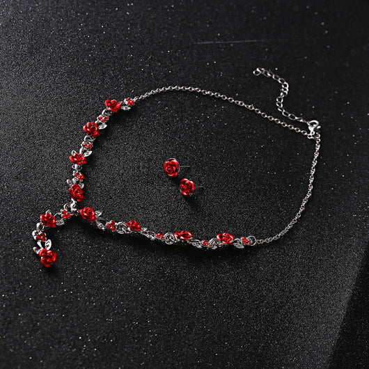 Red rose alloy necklace and stud earrings set with silver-tone chain and clear accents, displayed on a black bust. - Image 9