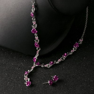 Red rose alloy necklace and stud earrings set with silver-tone chain and clear accents, displayed on a black bust. - Image 13
