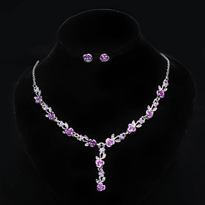 Red rose alloy necklace and stud earrings set with silver-tone chain and clear accents, displayed on a black bust. - Image 18