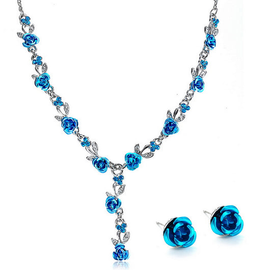Red rose alloy necklace and stud earrings set with silver-tone chain and clear accents, displayed on a black bust. - Image 20