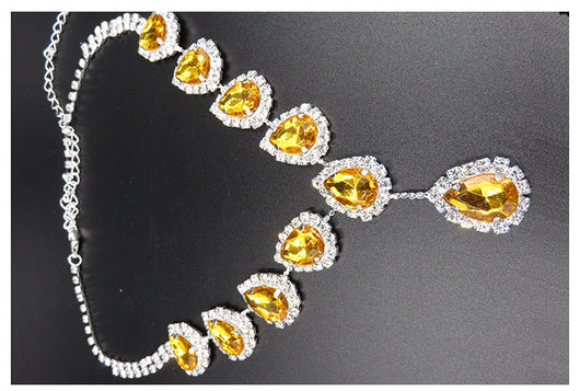 Bridal jewelry set with a silver-tone necklace and matching drop earrings, featuring orange teardrop rhinestones. - Image 7