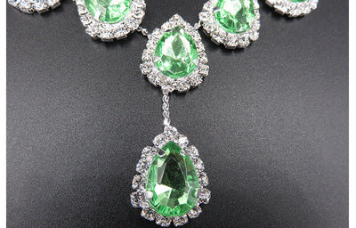 Bridal jewelry set with a silver-tone necklace and matching drop earrings, featuring orange teardrop rhinestones. - Image 9