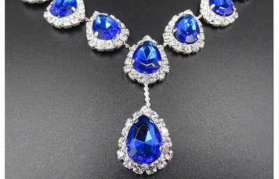 Bridal jewelry set with a silver-tone necklace and matching drop earrings, featuring orange teardrop rhinestones. - Image 12