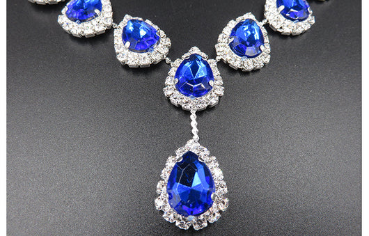 Bridal jewelry set with a silver-tone necklace and matching drop earrings, featuring orange teardrop rhinestones. - Image 12