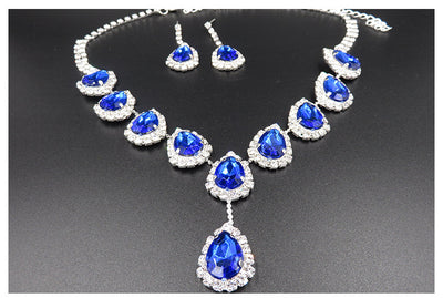 Bridal jewelry set with a silver-tone necklace and matching drop earrings, featuring orange teardrop rhinestones. - Image 13