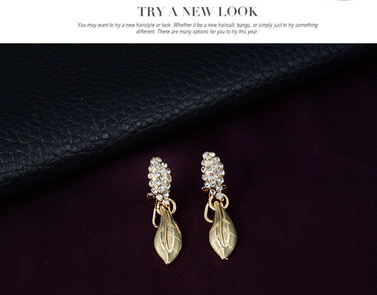 Gold-toned four-piece bridal wedding jewelry set with leaf design and clear rhinestones, including necklace, earrings, bracelet, and ring. - Image 11