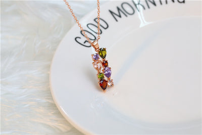 Shiny rose gold-tone necklace, earrings, and ring set with multi-colored teardrop and round zircon stones. Ring size 9. - Image 16
