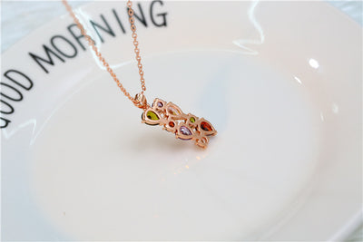Shiny rose gold-tone necklace, earrings, and ring set with multi-colored teardrop and round zircon stones. Ring size 9. - Image 18