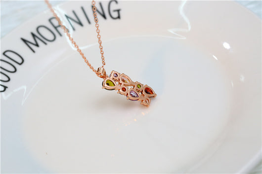 Shiny rose gold-tone necklace, earrings, and ring set with multi-colored teardrop and round zircon stones. Ring size 9. - Image 18