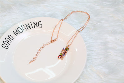 Shiny rose gold-tone necklace, earrings, and ring set with multi-colored teardrop and round zircon stones. Ring size 9. - Image 19
