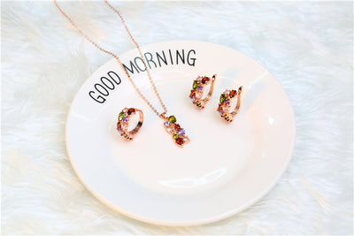 Shiny rose gold-tone necklace, earrings, and ring set with multi-colored teardrop and round zircon stones. Ring size 9. - Image 21