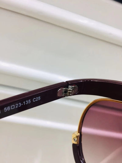 Black cat-eye half-frame sunglasses with gold accents and purple-grey gradient lenses, shown from front and side. - Image 14